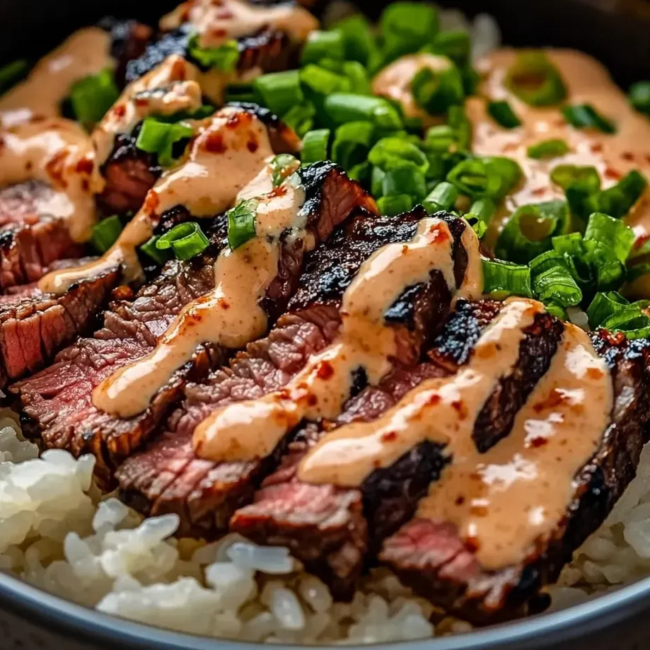 A plate of Korean BBQ steak with rice.