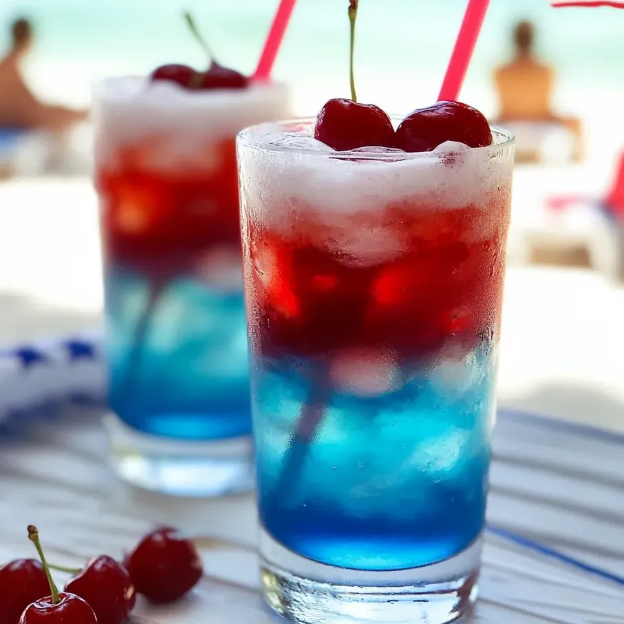 Two glasses of red white blue kid's drink.