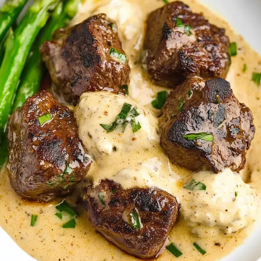 A plate piled with garlic butter steak chunks.