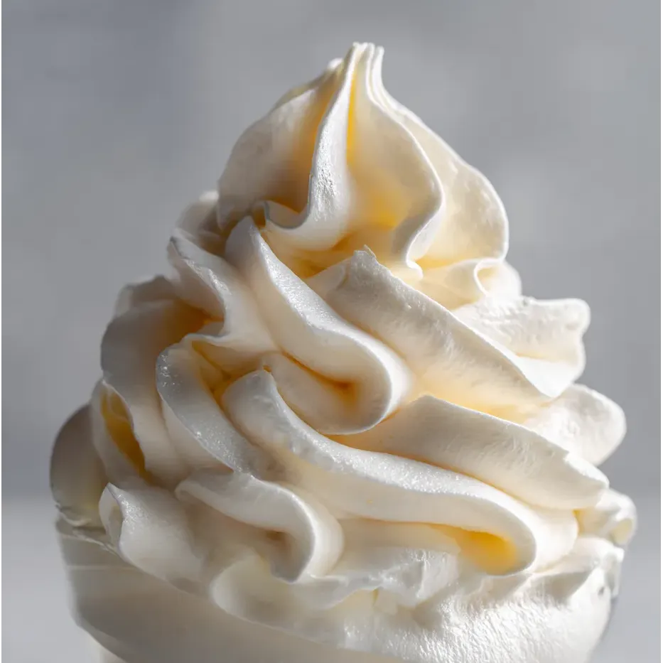 A frosted treat with a creamy white swirl.