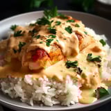 Creamy chicken on rice with sauce.