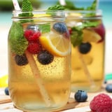 Two glasses of mint green tea with slices of lemon.