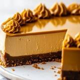 A big wedge of chocolate cake getting a caramel pour.