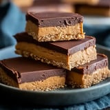 A stack of chocolate and peanut butter bars.
