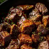 A close up of a pan of meat.